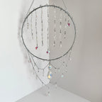 Decorative hanging with beads and stars on a neutral background