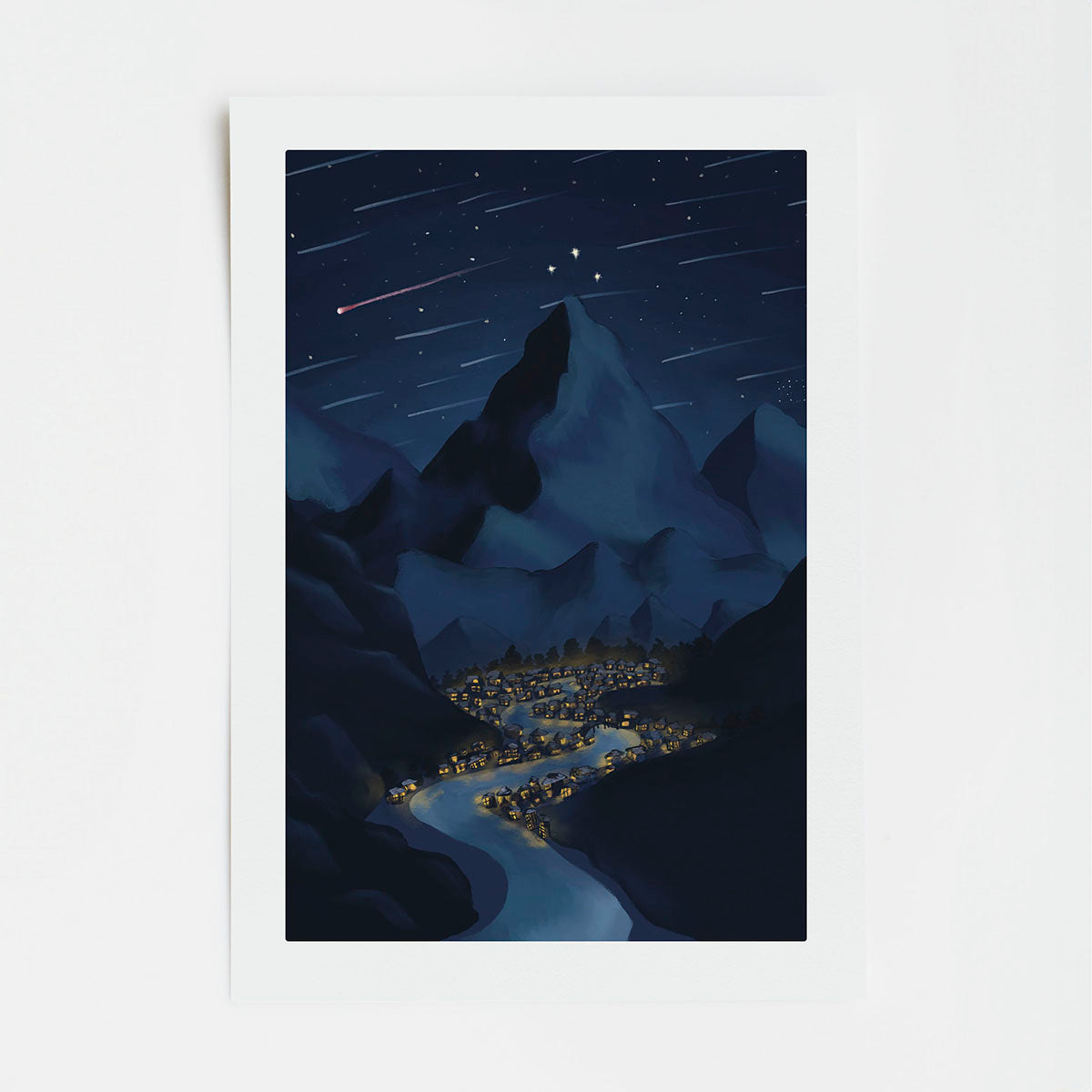 artwork of a mountainous landscape at night with stars and a small town below with a white border.